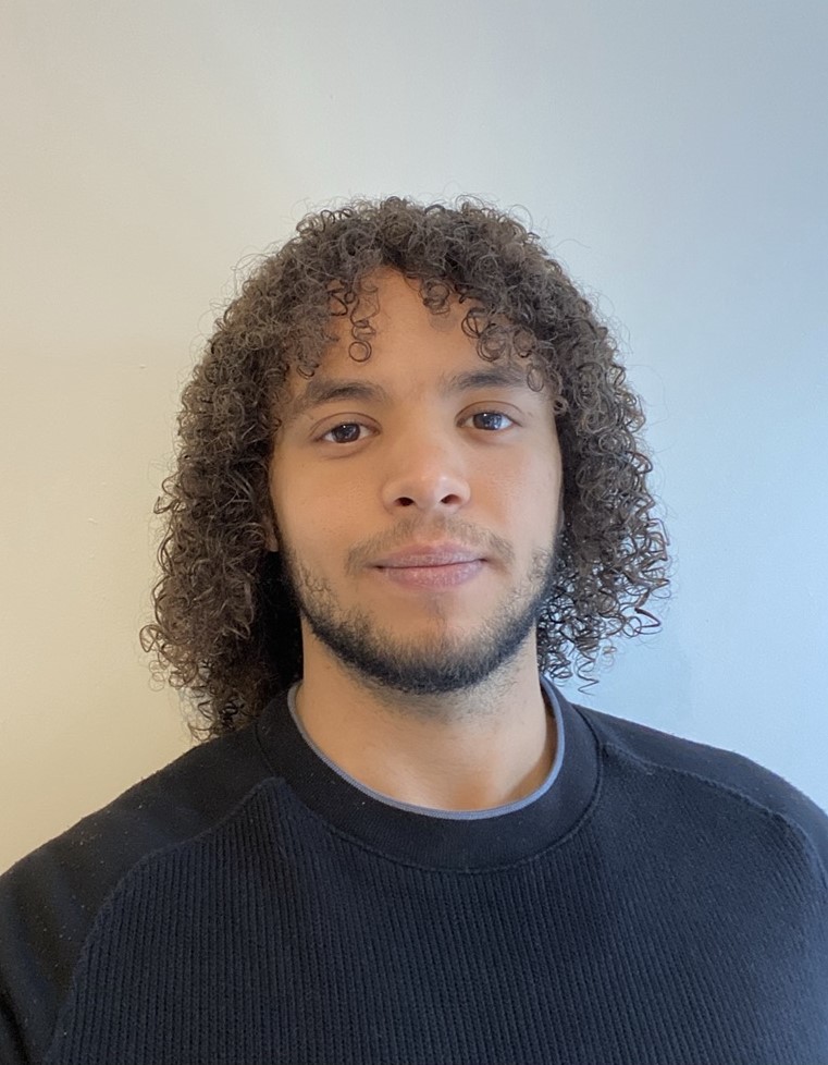 Josh, a UK Registered Nutritionist, in soft daylight.